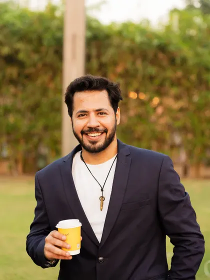 A candid portrait from the Udgam Kids Karnival. Taking a moment to enjoy the outdoor setting before getting back to the high-energy hosting duties.