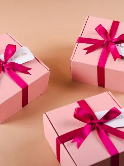 All packed and ready to go. Our pink bridesmaid boxes look so pretty with their magenta ribbons and custom tags.