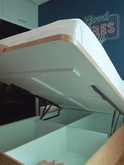 Another view of our popular gas pump lift-up bed. The internal storage box is finished in white laminate, making it bright, easy to clean, and simple to organize.