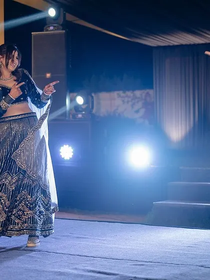 A playful pose during their choreographed dance. You can see how much fun they're having.