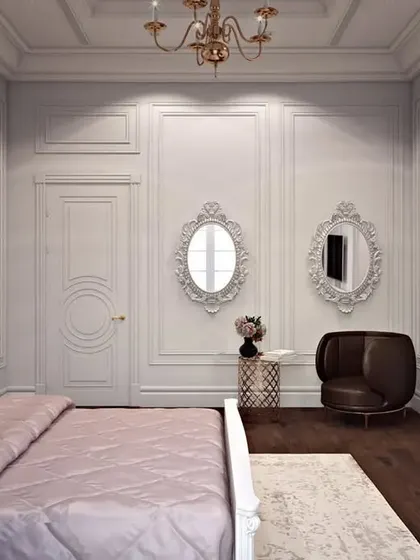 This bedroom combines classic paneling with a textured metallic-finish accent wall for a touch of modern glamour.