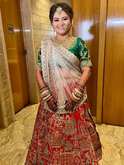 The complete look, showcasing the intricate lehenga and the beautifully coordinated makeup.