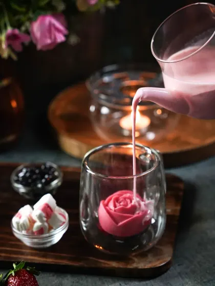 We love creating moody and dramatic visuals. Here, we used soft, focused light to capture the elegant pour of a rose-flavored boba tea. The deep shadows and minimal props make the textures and colors stand out, turning a simple drink into a moment of art.