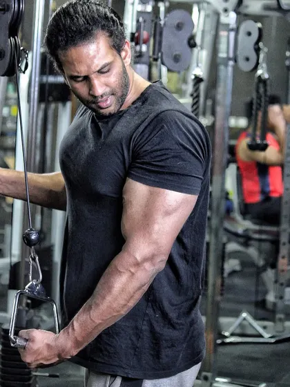 The Lord is on my side. A shot of me during a tricep pushdown, one of my favorite arm exercises.