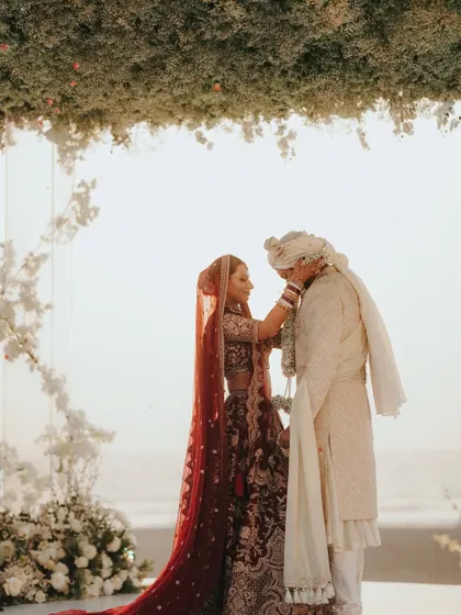 A tender moment during the varmala exchange. These are the memories that will be cherished forever.