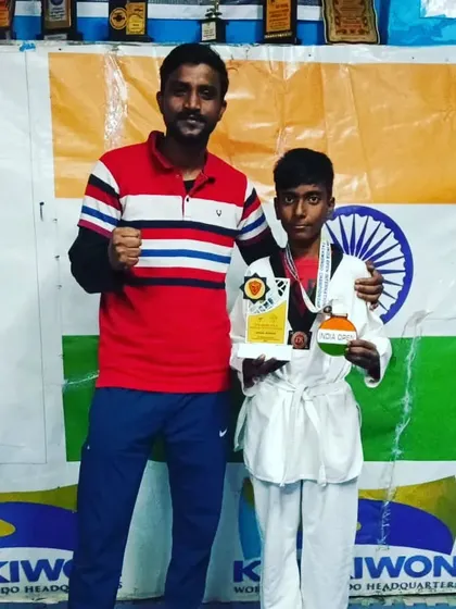 A handshake and a thumbs up for this young champion.