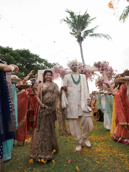 The groom and his mother walking through the path created by the dancing family members. A truly special moment.