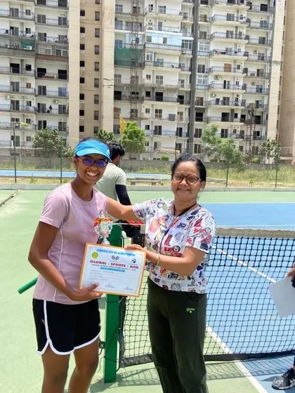 Khushi Sharma receiving her runner-up trophy for the U-16 girls' singles category.