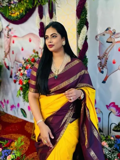 Mukta looking regal in her yellow and purple Irkal saree. The custom striped blouse and her elegant jewelry complete this stunning traditional look.