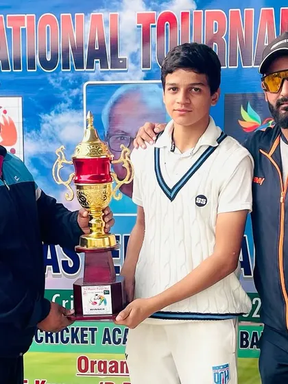 Another shot of our player receiving the trophy.