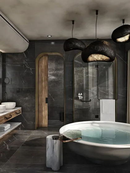 A luxurious bathroom design featuring dark marble, a freestanding circular tub, and unique pendant lighting. This rendering creates a spa-like atmosphere, emphasizing relaxation and high-end finishes.