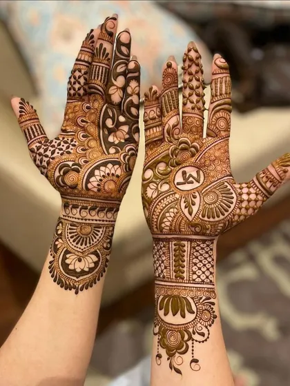 A personalized bridal design featuring the couple's initials 'M' and 'A' cleverly integrated into the pattern.