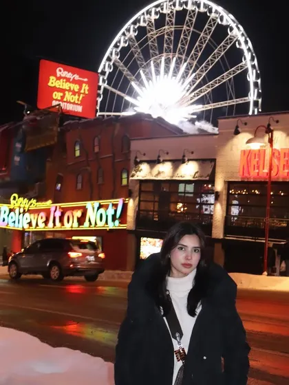 Posing in front of the iconic Clifton Hill attractions in Niagara Falls during winter.
