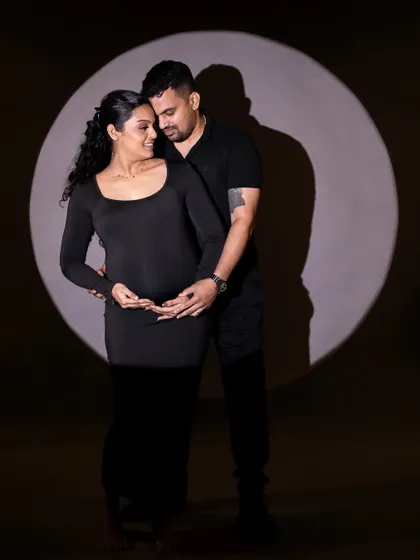 A dramatic spotlight portrait of the couple, creating a timeless and artistic image that focuses on their connection.