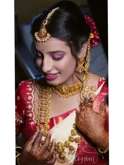 A close-up of my bridal makeup. I wanted a look that was defined but not heavy, using pink tones on my eyes and lips to complement my saree.