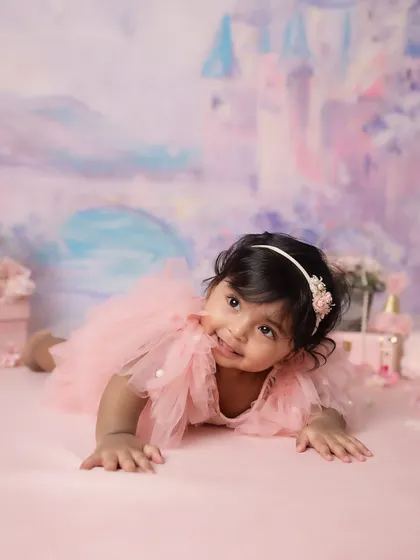 A shy, sweet glance. This photo captures a quiet, gentle moment during our princess-themed half-birthday shoot.