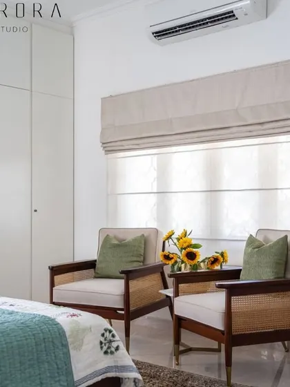 The beautiful caned lounge chairs in a bedroom setting, providing a perfect spot to relax with a morning coffee.
