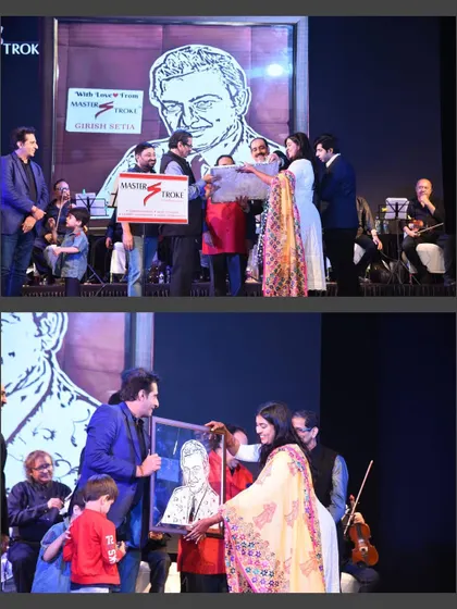 On stage, presenting the framed portrait of the late Madan Mohan to his son, Mr. Sameer Kohli. This happened at a concert organized in memory of his iconic songs.