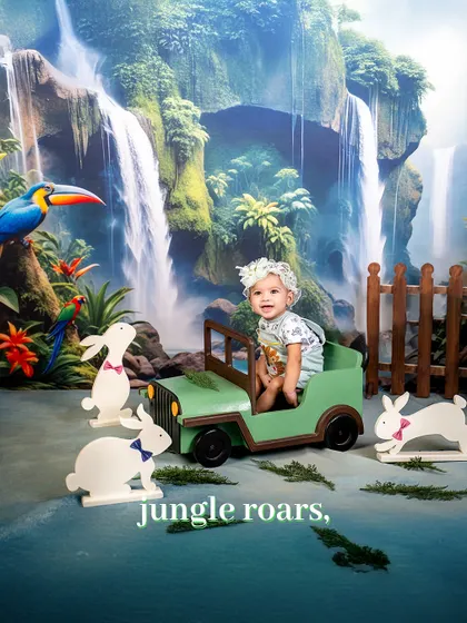 Jungle roars from the cutest explorer. This little girl is having a blast in her mini jeep, surrounded by friendly rabbits and a lush waterfall backdrop.