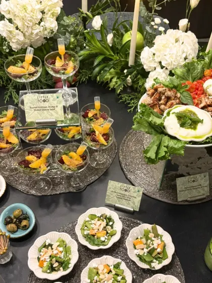 A fresh and healthy section of a grazing table, featuring Burrata salad with pesto, individual quinoa salads with orange and beetroot, and other light options. This shows our ability to incorporate nutritious and gourmet choices into any spread.