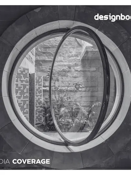 Our House of Solid Stone project was featured in Designboom. The photo shows a unique pivoting circular window set within a heavy stone wall, a playful yet precise detail.