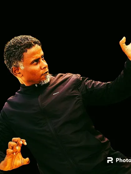 A stylized photo showing a classic Kung Fu posture. The art form is not only practical but also has a deep, visual beauty that reflects its internal principles.