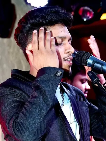 Lost in the music. This close-up shot shows the focus and emotion that goes into every note I sing, backed by the powerful sound of my band.