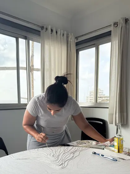 In my studio, with natural light pouring in, I get lost in the process. Each artwork is a journey, and this image captures a moment of that quiet, focused creation.