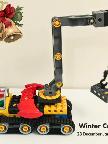 A student-built crane from our "Santa's Little Builders" Winter Camp. This project teaches kids about pulleys, levers, and structural engineering.