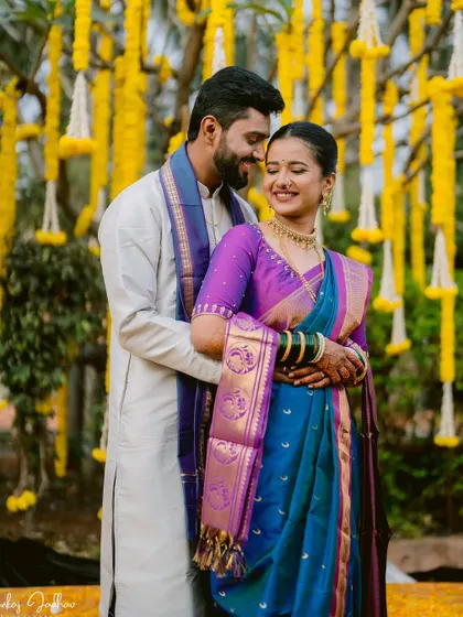 A warm and happy embrace between the couple on their wedding day.
