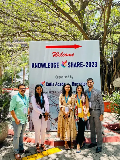 A duplicate image with my colleagues at the entrance of the conference, ready to engage with the latest in dermatology.