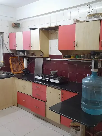 **BEFORE:** A classic case of a dated and dark kitchen. The layout was inefficient, storage was lacking, and the color scheme made the space feel smaller than it was.