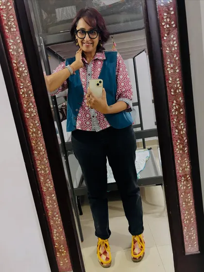 Another pose in the mirror, feeling good about my creative outfit combination.