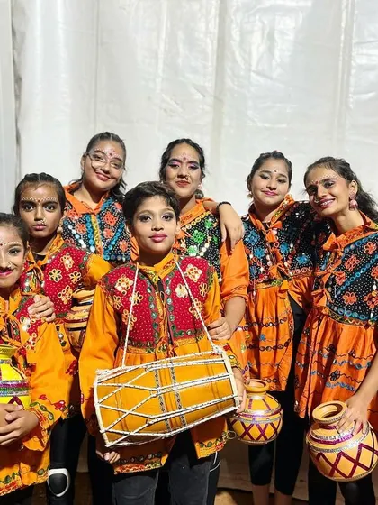 A powerful group pose from our performance team. They are ready to bring their energy and culture to the stage.