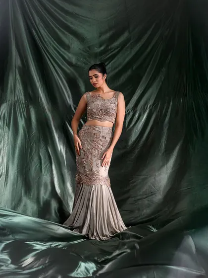 Another angle of the mermaid gown, showcasing the silhouette and elegant posing.