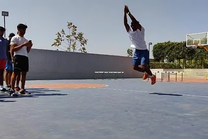 A participant at our plyometrics workshop demonstrates a standing broad jump. These workshops are highly practical, with a strong emphasis on hands-on learning and proper execution.