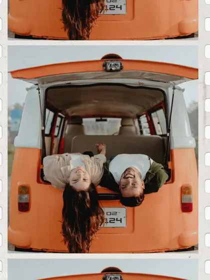 A playful, upside-down shot of the couple peeking out from the back of the van.