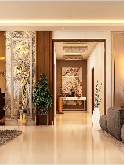 This open-plan layout shows how we seamlessly connect living and dining areas. The consistent use of warm wood, metallic accents, and polished marble flooring creates a harmonious flow throughout this luxury apartment interior.