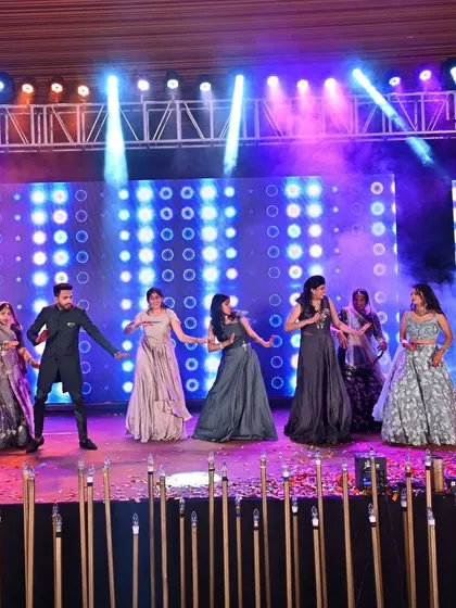The groom and his family take over the stage in this high-energy group performance. We ensure our choreography is fun and accessible, so everyone from siblings to parents can join in and have a great time.