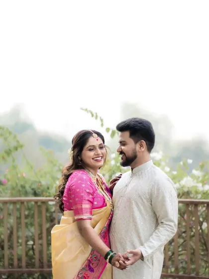 A candid, happy moment between a couple during their pre-wedding shoot. Their genuine smiles and easy interaction are the focus of this shot.
