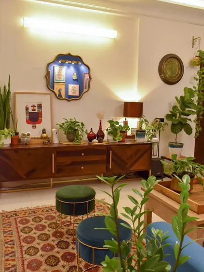 This angle shows how I've used a variety of plants to decorate my console table, turning it into a green statement piece.