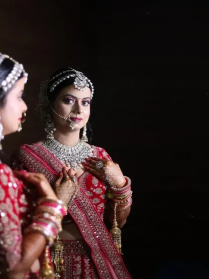 This stunning bride in her red lehenga is a perfect example of a classic North Indian bridal look. We focused on radiant skin, bold eyes, and a traditional bridal bun adorned with flowers.