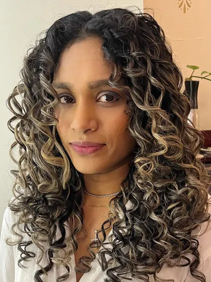 A curl transformation for Tanya, treated with K18 and styled with Manetain conditioner for ultimate health and definition.