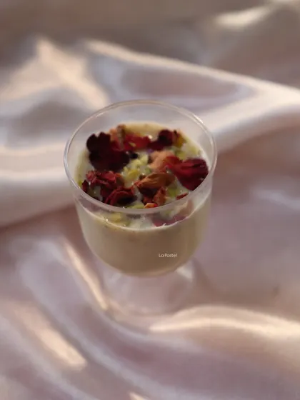 A single serving of my Holi special Thandai mousse, garnished with rose petals and pistachios.