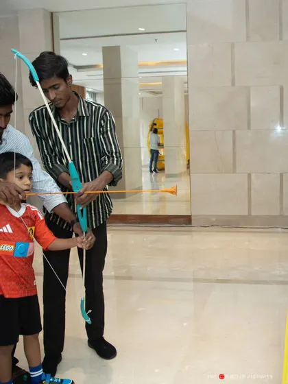 An archery game was one of the activities available for guests at the football-themed party, providing a variety of entertainment.