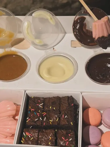 My Exotic Dessert Box is a dream for anyone with a sweet tooth. It includes mini macarons, brownie bites, and strawberry madeleines with three different dessert sauces for dipping.