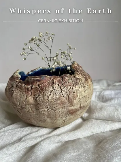 This beautiful, rustic vase with a cracked texture and a deep blue interior was made by the artist Mukta. It perfectly captures the raw beauty of the earth.