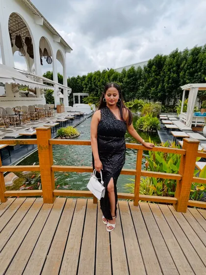 The client looking chic and confident in her custom party dress.