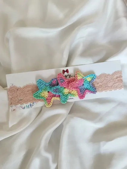 A single pastel rainbow star headband, perfect for adding a touch of magic to your baby's outfit.