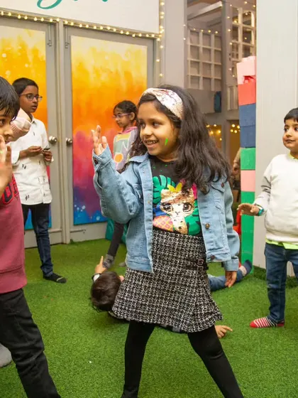 Time for a dance party! The kids show off their best moves during a game of dance and freeze, filling the room with energy and laughter.